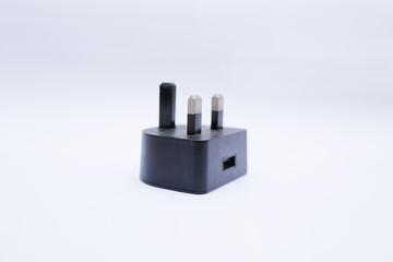 Black USB charger head/adapter isolated on a white background