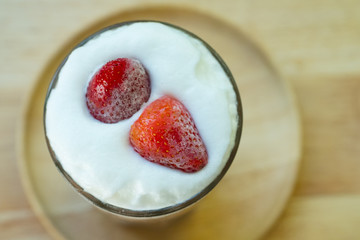 Fresh of strawberry on milk foam