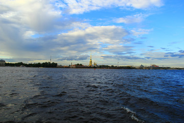 Fototapeta na wymiar View of the Peter and Paul Fortress from the Neva on a Summer Evening