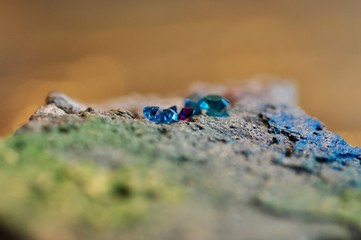 sparkling glitter colorful diamonds on concret cement background 