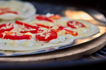 detail of fresh and delicious tarte Alsatian with cheese and paprika tomato grilled