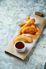 Churos spanish dessert. Gray textured background. Beautiful serving dishes. Dessert. Food chain