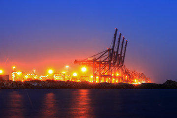 Cranes at the cargo terminal in the evening