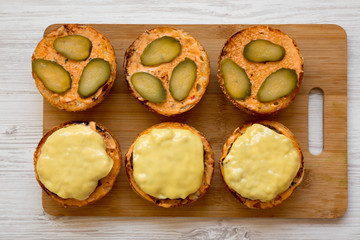 Cooking cheeseburger step-by-step, top view. Overhead, from above. Close-up.