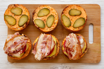 Cooking cheeseburger step-by-step, top view. Flat lay, from above, overhead. Close-up.