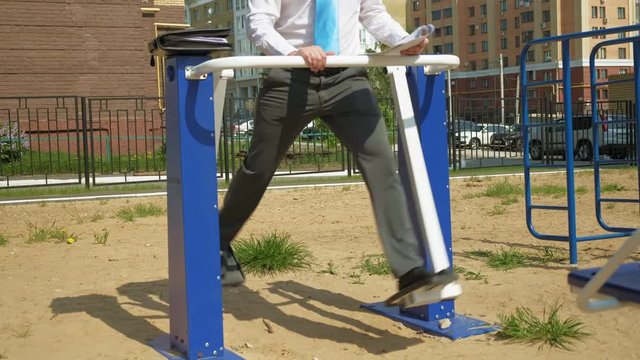 Businessman on an outdoor sports field. The concept of a healthy lifestyle.
