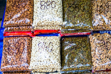 Nuts, dry fruits and pulses packed in clear plastic bags with prices