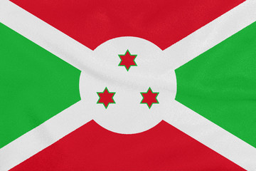 Flag of Burundi on textured fabric. Patriotic symbol