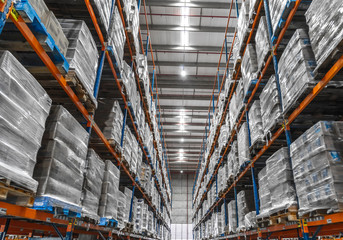 logistic shed and distribution boxes workers and forklift in operation