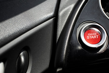 Red button engine start cockpit car close up still