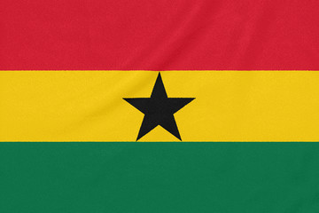 Flag of Ghana on textured fabric. Patriotic symbol