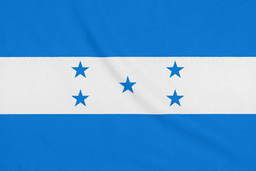 Flag of Honduras on textured fabric. Patriotic symbol