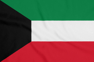 Fototapeta premium Flag of Kuwait on textured fabric. Patriotic symbol