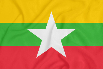 Flag of Myanmar on textured fabric. Patriotic symbol