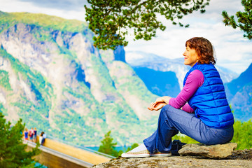 Tourist enjoying mountains fjord view, Norway