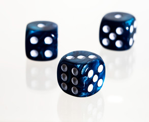 Three blue casino dice with white background