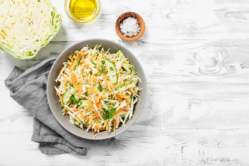 Fresh Cabbage salad with carrots and greens.