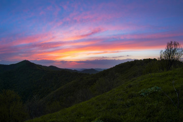 Fototapeta premium The natural background of the secret light of the evening sky on the panoramic viewpoint, can see the surrounding atmosphere (trees, mountains, clouds) 