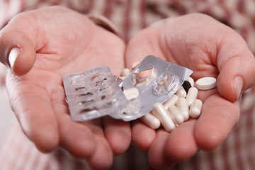 Pills in hand close up