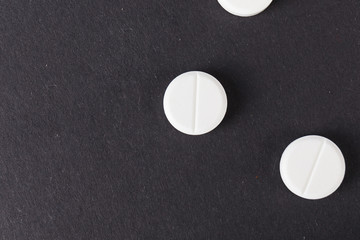 Pills close up on black background