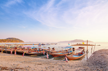 Travel by Thailand. Landscape with traditional longtail fishing boat on the sea beach.