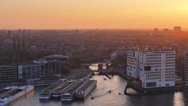 amsterdam ij dock port area aerial view at sunset boat ship on river