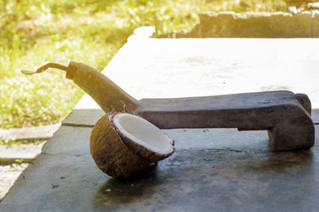 Scrape the coconut to make coconut milk. to be used as an ingredient in the food with the selected...