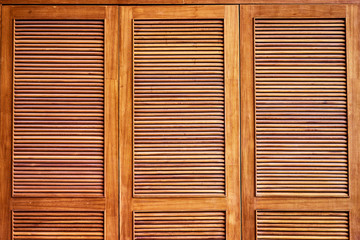 Wooden shutters, louvers. Textured background.