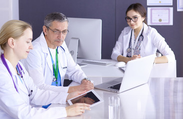 Doctors having a medical discussion in a meeting room