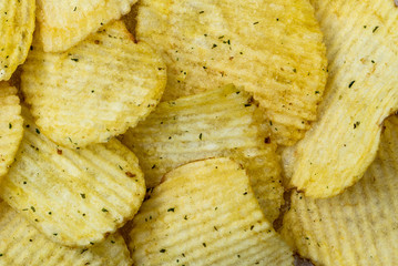 Fluted chips, a beer snack. Top view. Selective focus.