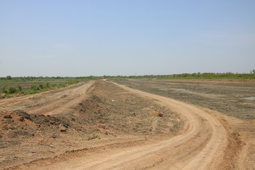 Fototapeta na wymiar The dirt road used for suburban traffic in Thailand - Image