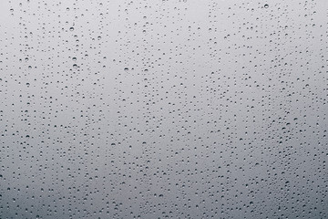 Rain drops on window glasses natural pattern of raindrops background