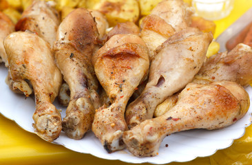 Baked chicken legs on plate