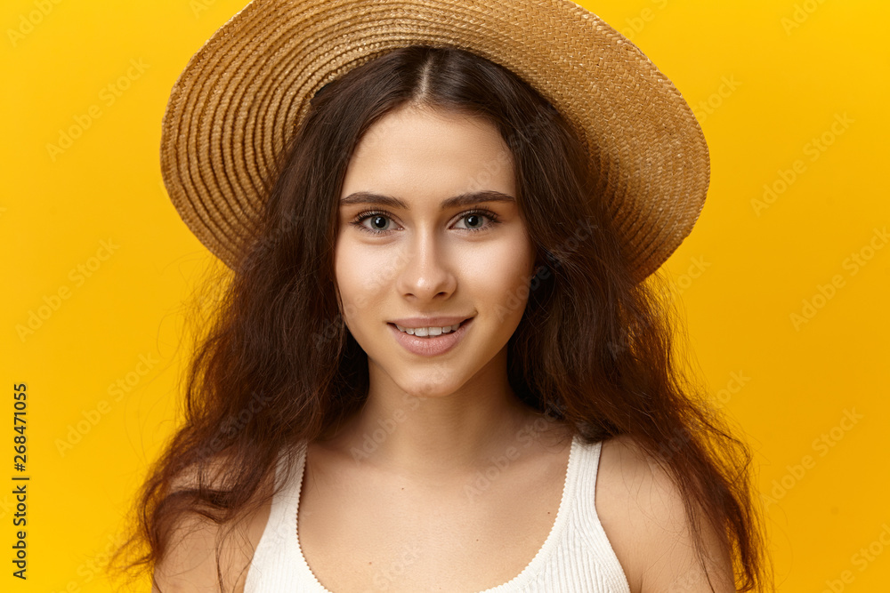 Wall mural style, beauty, fashion and people concept. studio shot of cute romantic girl wearing white top and b