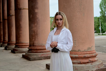 Fashion look's woman. Young woman modern portrait. Young woman dressed in white skirt and shirt...