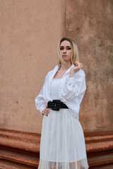 Fashion look's woman. Young woman modern portrait. Young woman dressed in white skirt and shirt...