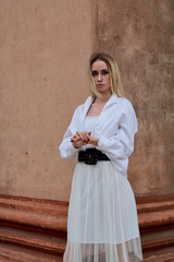 Fashion look's woman. Young woman modern portrait. Young woman dressed in white skirt and shirt...