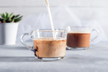Two Cups of coffee on grey background