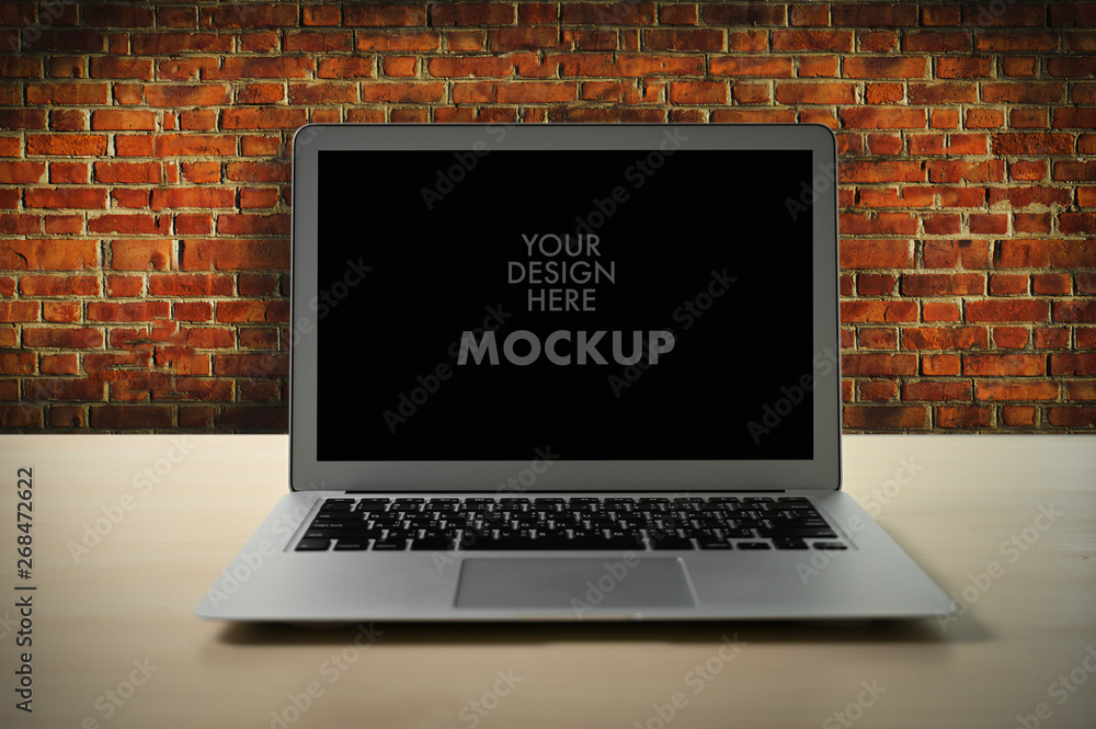 Poster mockup image of business laptop with blank screen on table blank copy space screen for your advertis