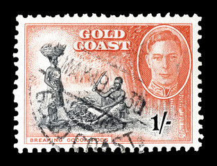 Cancelled postage stamp printed by Gold Coast, that shows Breaking of Cocoa Pods and portrait of...
