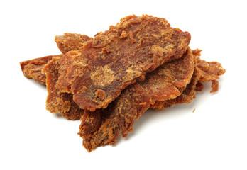 Slices of beef jerky on white background