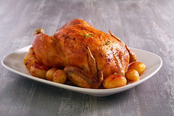 Roast whole chicken with potatoes