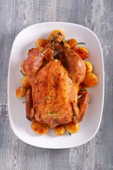Roast whole chicken with potatoes
