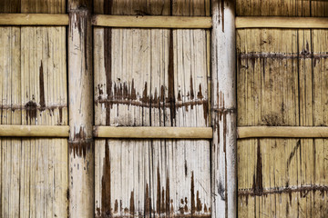Background of wooden bamboo wall of a building in the Philippines close up