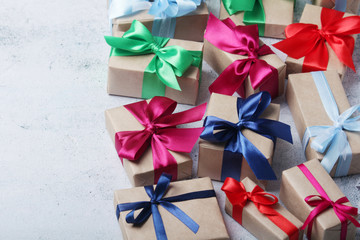 Gifting boxes with colorful satin ribbon bows	