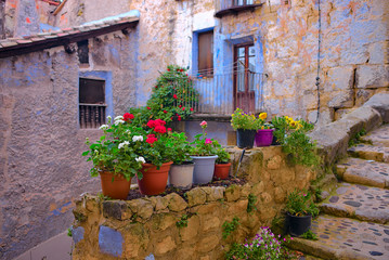 Fototapeta na wymiar Pots with flowers in Valderrobres. Spain