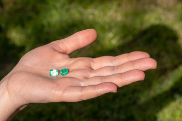 Green Emerald Holding in Hand