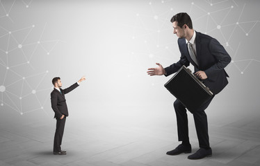Small businessman aiming at a big businessman with connection and network concept
