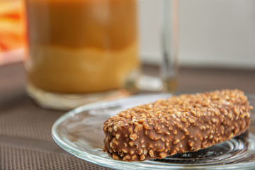 Cup of coffee with milk and chocolate cake