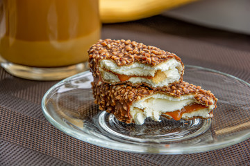 Two pieces of chocolate cakes and a cup of coffee